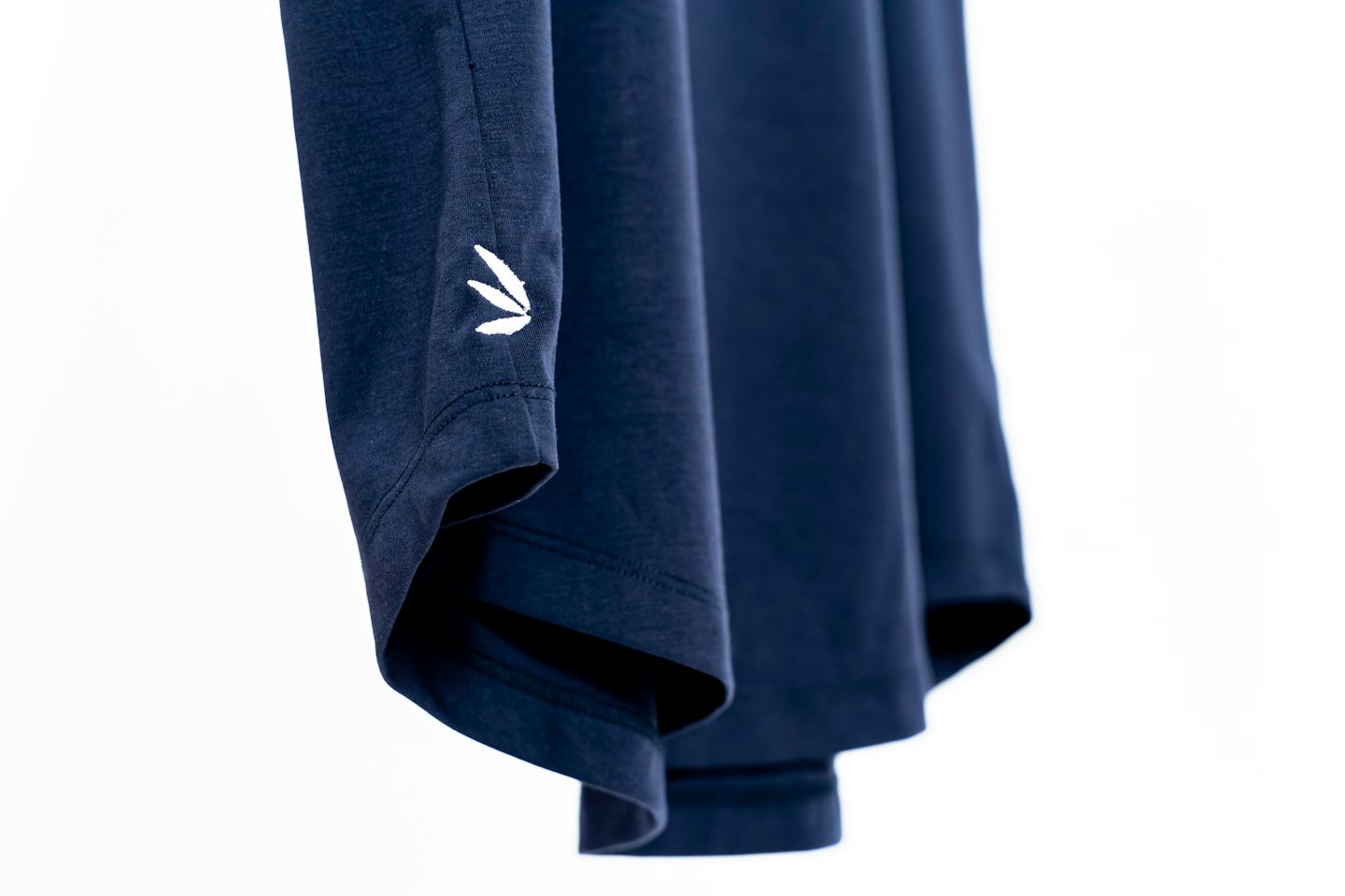 Dark navy cotton t-shirt with a small white embroidered logo.